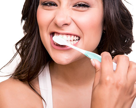 Woman Brushing Teeth